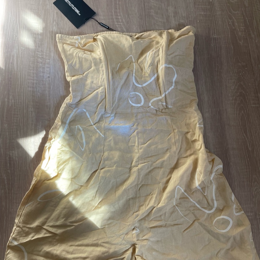 Yellow Strapless Jumpsuit with White Pattern